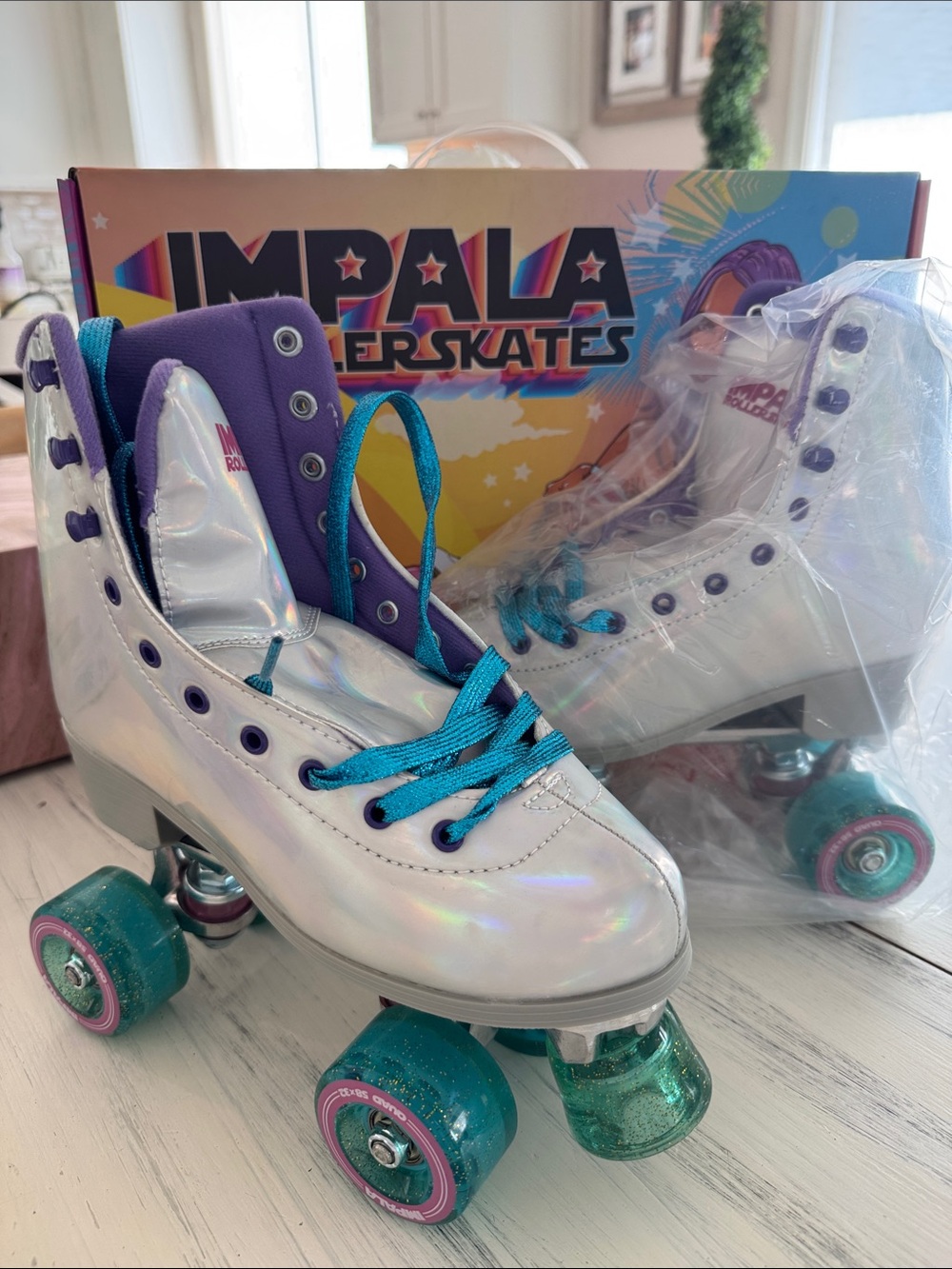 Impala Roller Skates in Iridescent White with Teal Accents